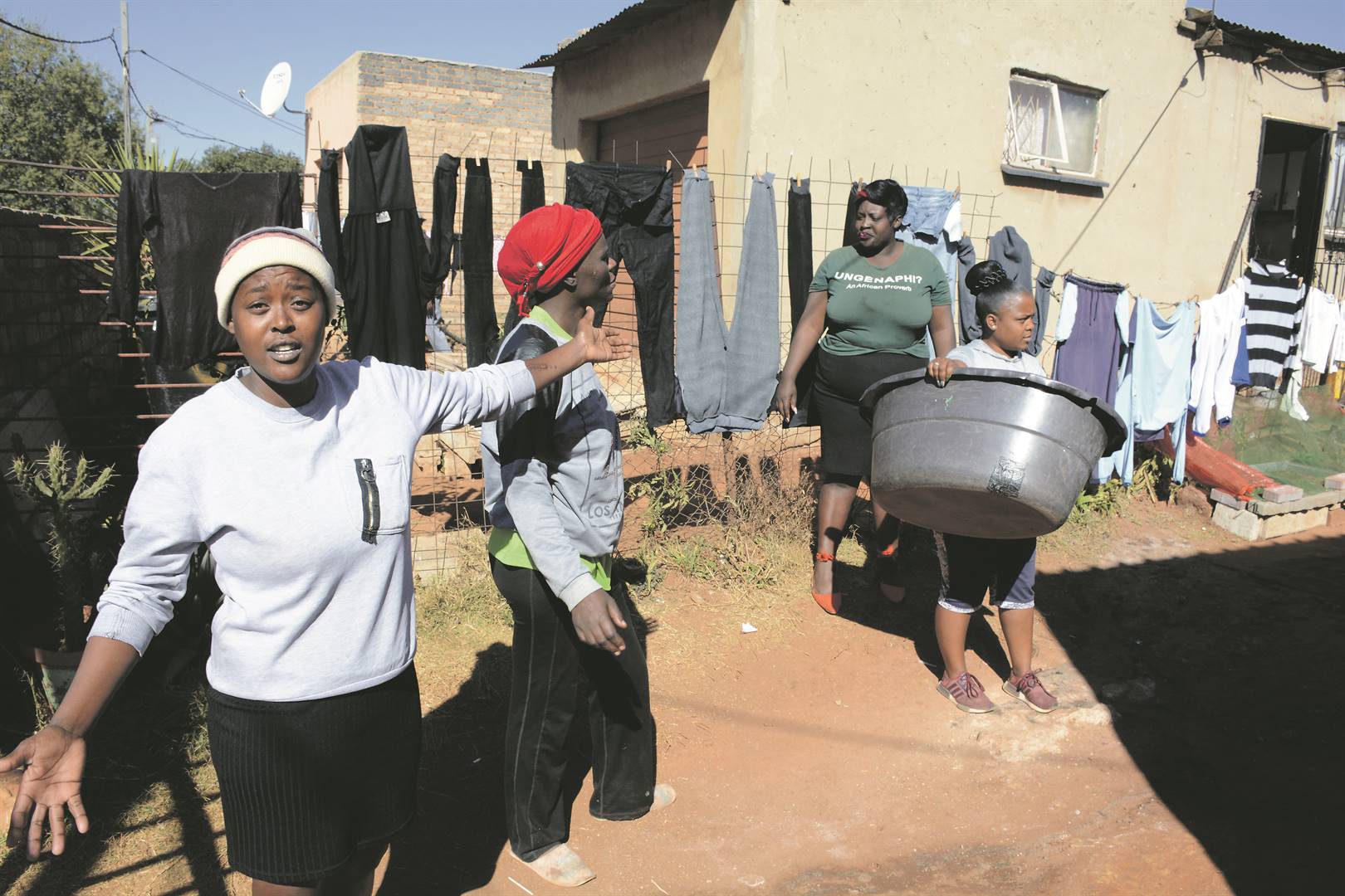 The washing line body guards: Nthabiseng Sello, Sylvia Lekwape, Ntsotiseng Lekhuleni and Lebo Rafuza from Wattvile in Benoni team up to safe guard their washing from being stolen. Photo by Muntu NkosiPhoto by 
