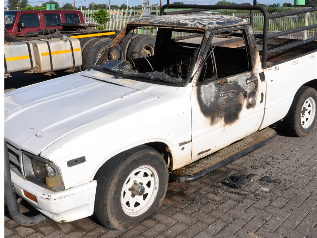 Residents torched this bakkie on Wednesday. Photo by Samson Ratswana 