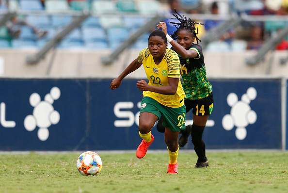 Banyana Banyana forward Rhoda Mulaudzi (L) vies with Jamaicas midfielder Deneisha Blackwood (R) during the International friendly 