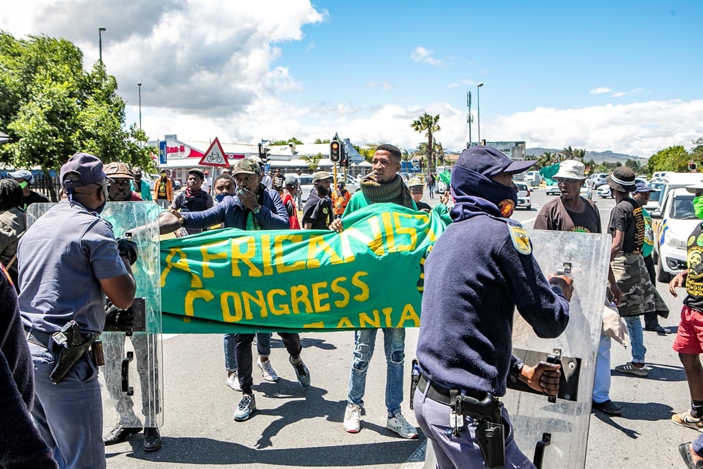 PAC members protest at the Brackenfell Train Station on 18 November 2020 in Brackenfell, South Africa. The protest comes after alleged racial discrimination at Brackenfell High School.