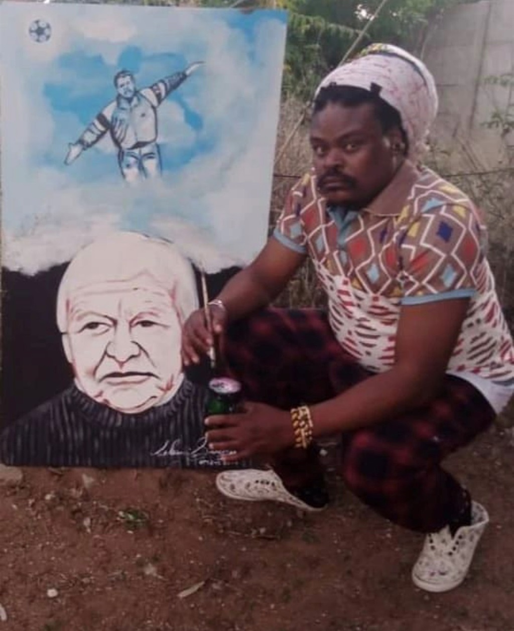 Rasta The Artist with his portrait of the late Cli
