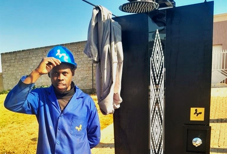 GREAT IDEA: Karabo Selepe with the mobile shower he created that will be the answer for many people, just like his name. Photo by Happy Mnguni