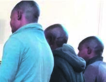 From left: Xifaniso Zwane, Nito Khoza and Shadi Mabote after appearing in the Mhala Regional Court.Photo by Tlangelani Khosa