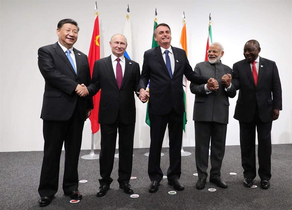 (From left) Chinese President Xi Jinping, Russian President Vladimir Putin, Brazilian President Jair Bolsonaro, India's Prime Minister Narendra Modi and South African President Cyril Ramaphosa shake hands as they pose during a BRICS summit meeting at the G20 summit in Osaka on June 28, 2019.