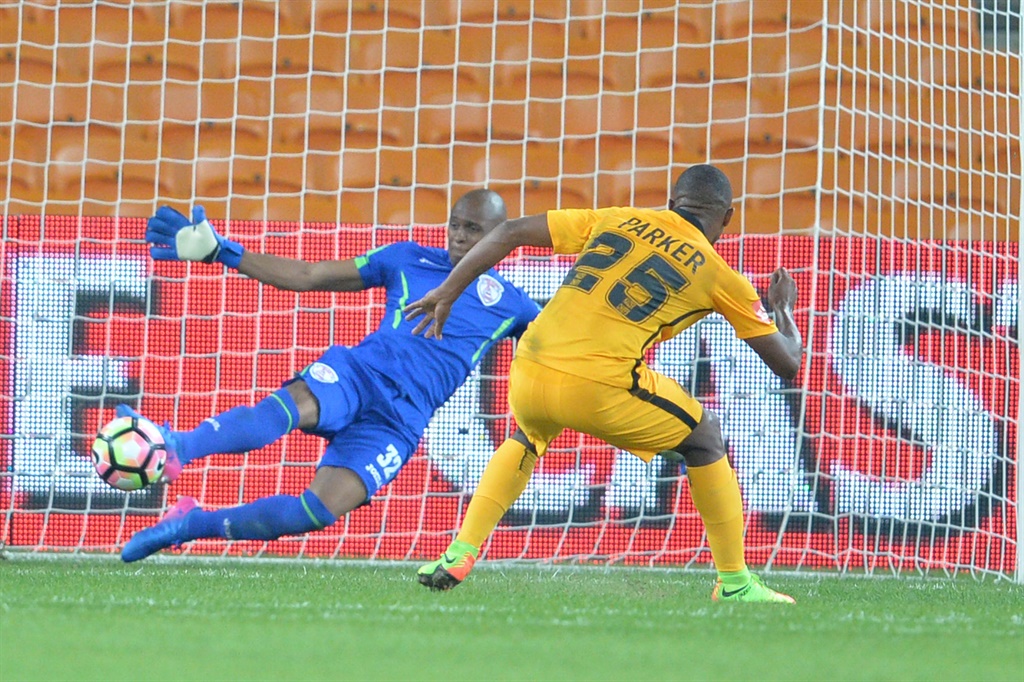 Bernard Parker score a goal while Thela Ngobeni 