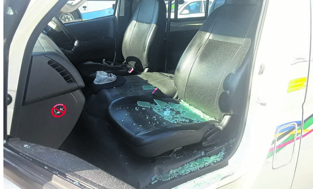 One of the taxis that was smashed during the shooting. Photo by Willem Phungula