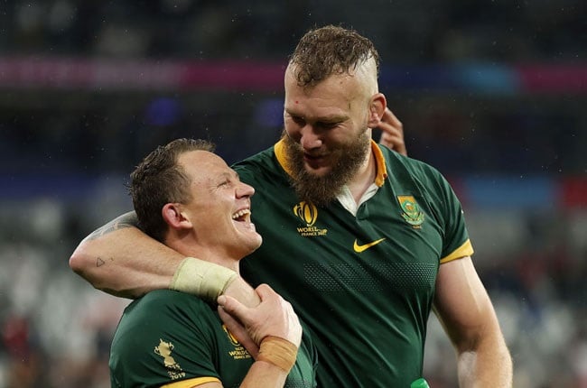 Deon Fourie celebrates with teammate RG Snyman following South Africa's victory during the Rugby World Cup semi-final against England. 