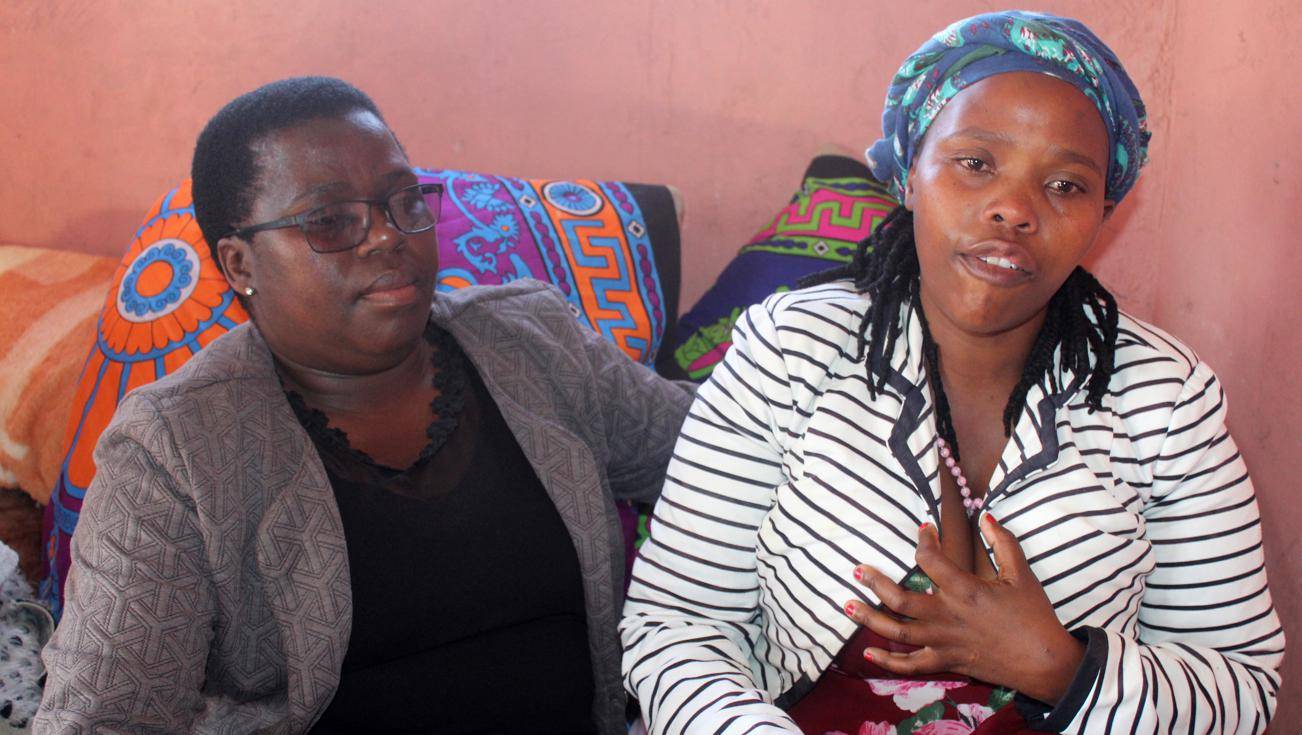 Left: Zaziwe Gani comforts grieving mum Phatheka Gani.Photo byZiyanda Zweni