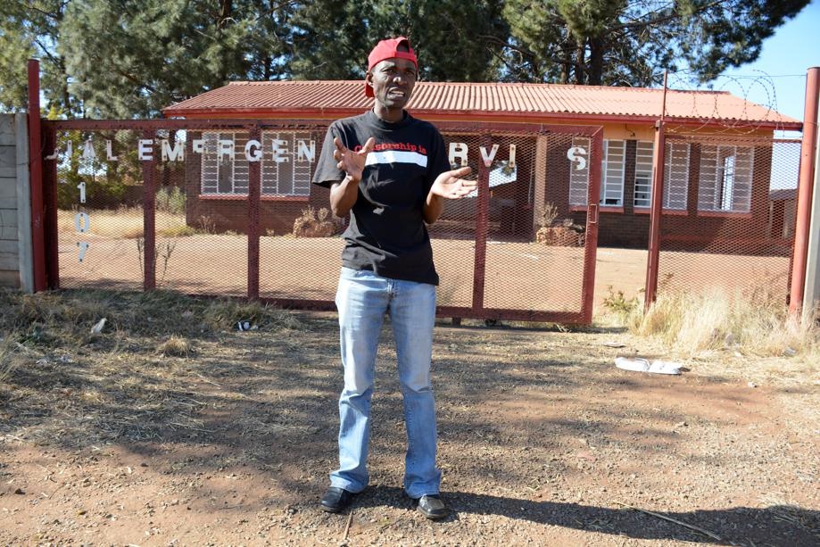 Less Tumo stands in front of the abandoned fire station at Khutsong, near Carletonville. Photo by Munti Nkosi
 