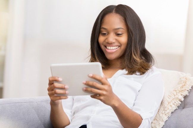 Young woman downloading the 22seven app