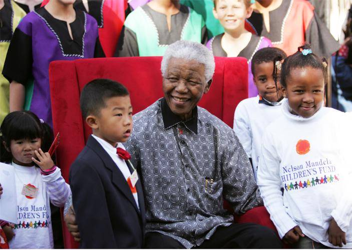 This photo, taken on July 20 2005, shows Nobel Peace Prize winner and iconic political prisoner Nelson Mandela celebrating his birthday party with children in Joburg Picture: Kim Ludbrook / EPA