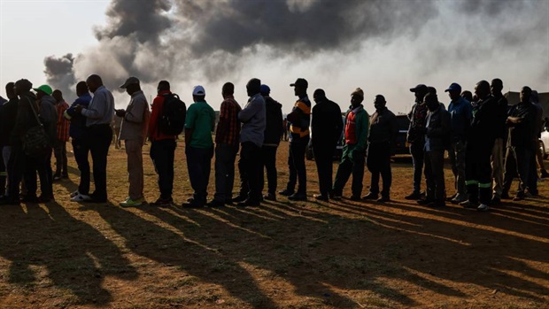 <p>Voters queue at a polling station during the presidential and legislative elections in Mbare, Harare.</p><p><em>(Photo by John Wessels/AFP)</em></p>