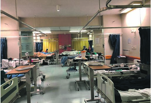 Above and left: Labour ward patients at Dora Nginza Hospital sleeping on chairs and stretchers.