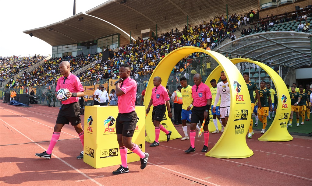 PRETORIA, SOUTH AFRICA - SEPTEMBER 23: Referees and players walking to the field during the MTN8 semi final, 2nd leg match between Mamelodi Sundowns and Kaizer Chiefs at Lucas Moripe Stadium on September 23, 2023 in Pretoria, South Africa. (Photo by Gallo Images)