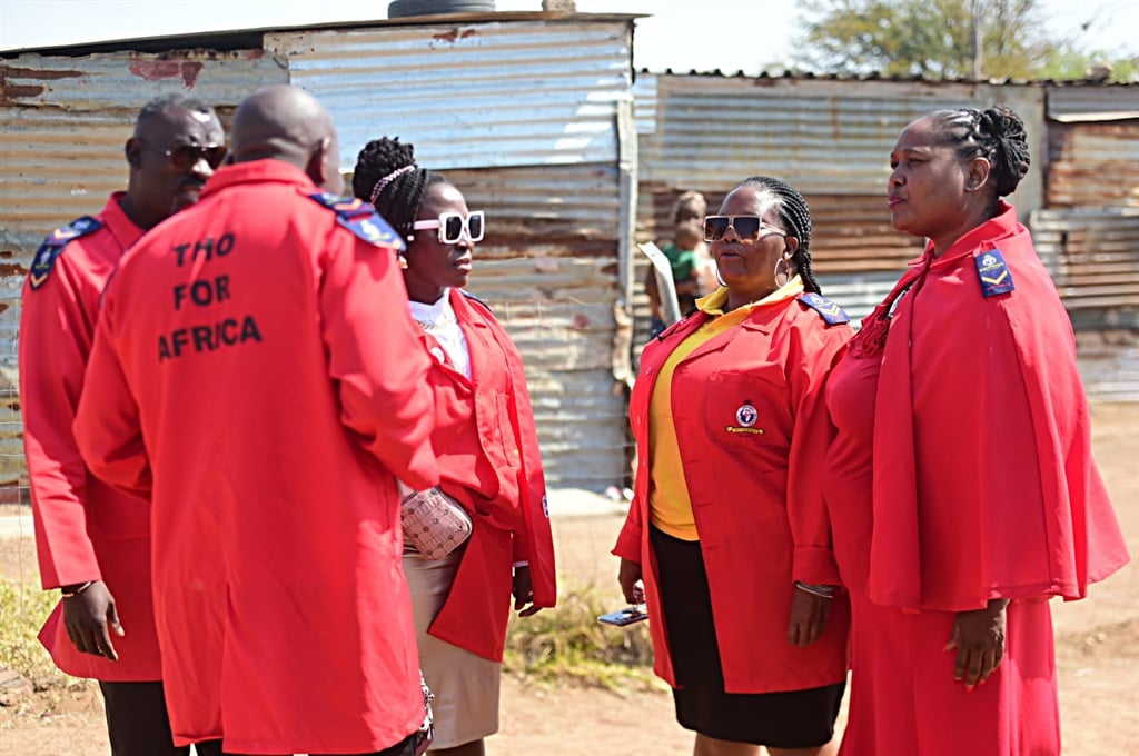 The Traditional Healers Organisation members outside the gobela's home. Photo by Raymond Morare 