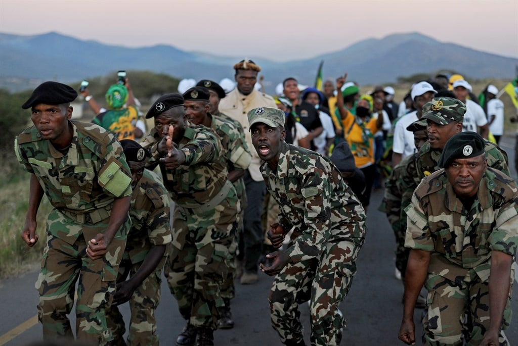 Supporters of former president Jacob Zuma and MKMVA members march on the road near his homestead in Nkandla. Photo: Tebogo Letsie/City Press