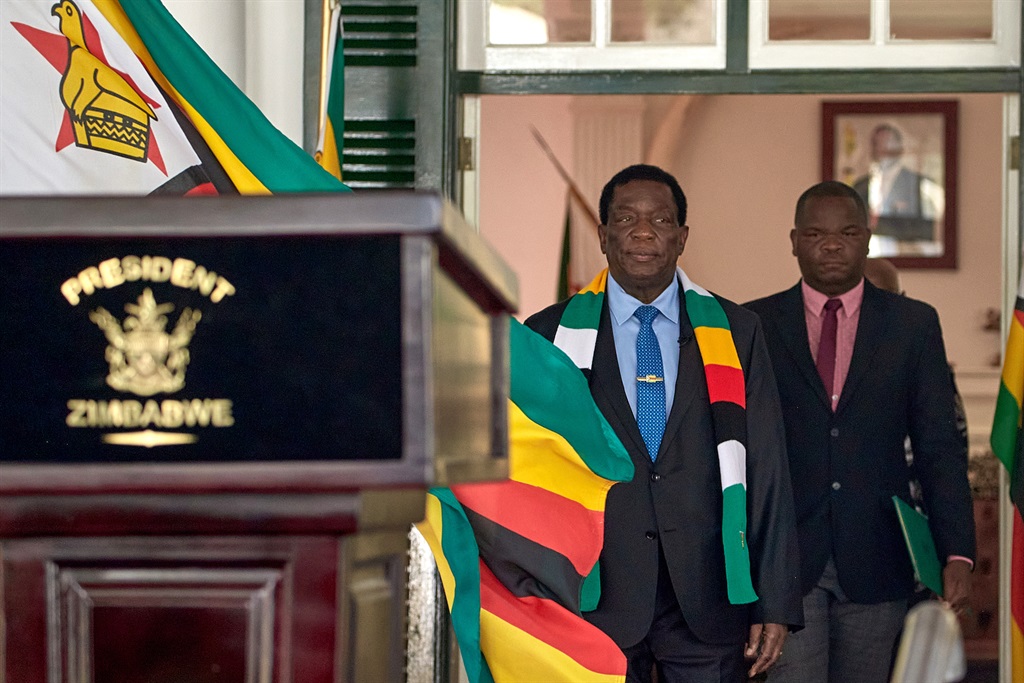 Emmerson Mnangagwa arrives for a press conference at State House in Harare on 27 August 2023.  