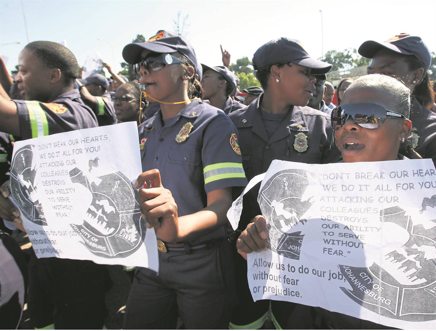 Emergency workers march to Durban Deep, west of Joburg.       Photo by                            Lucky Nxumalo
