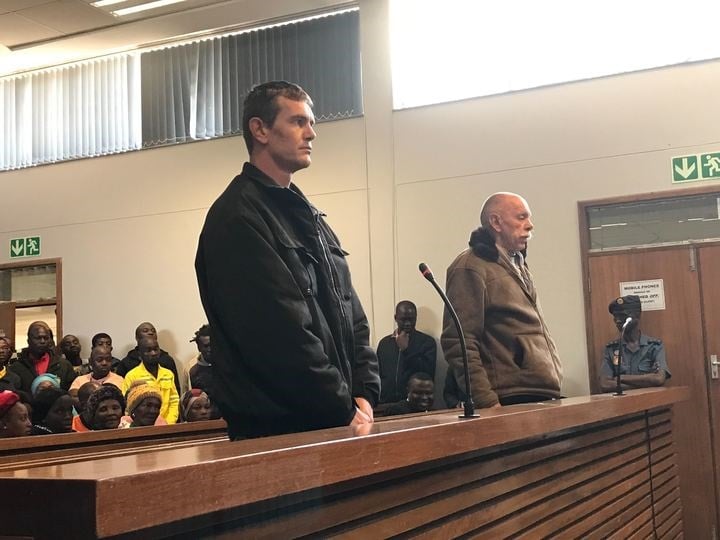 Garry Wiblin and his co-accused Dennis Grose who is also his fiancé’s father stand in the Delmas Regional Court dock. They are accused of killing a man on a farm before throwing his body over a bridge. (Alex Mitchley, News24)