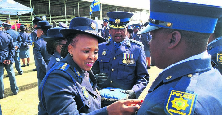 Lieutenant-General Dineo Ntsiea and Major-General Moeketsi Sempe award diligent cops with medals.Photo by Kabelo Tlhabanelo