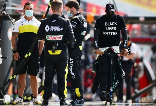 Lewis Hamilton rides a scooter in the Pitlane during the F1 Grand Prix of Italy at Autodromo di Monza on September 06, 2020 in Monza, Italy. (Photo by Peter Fox/Getty Images)