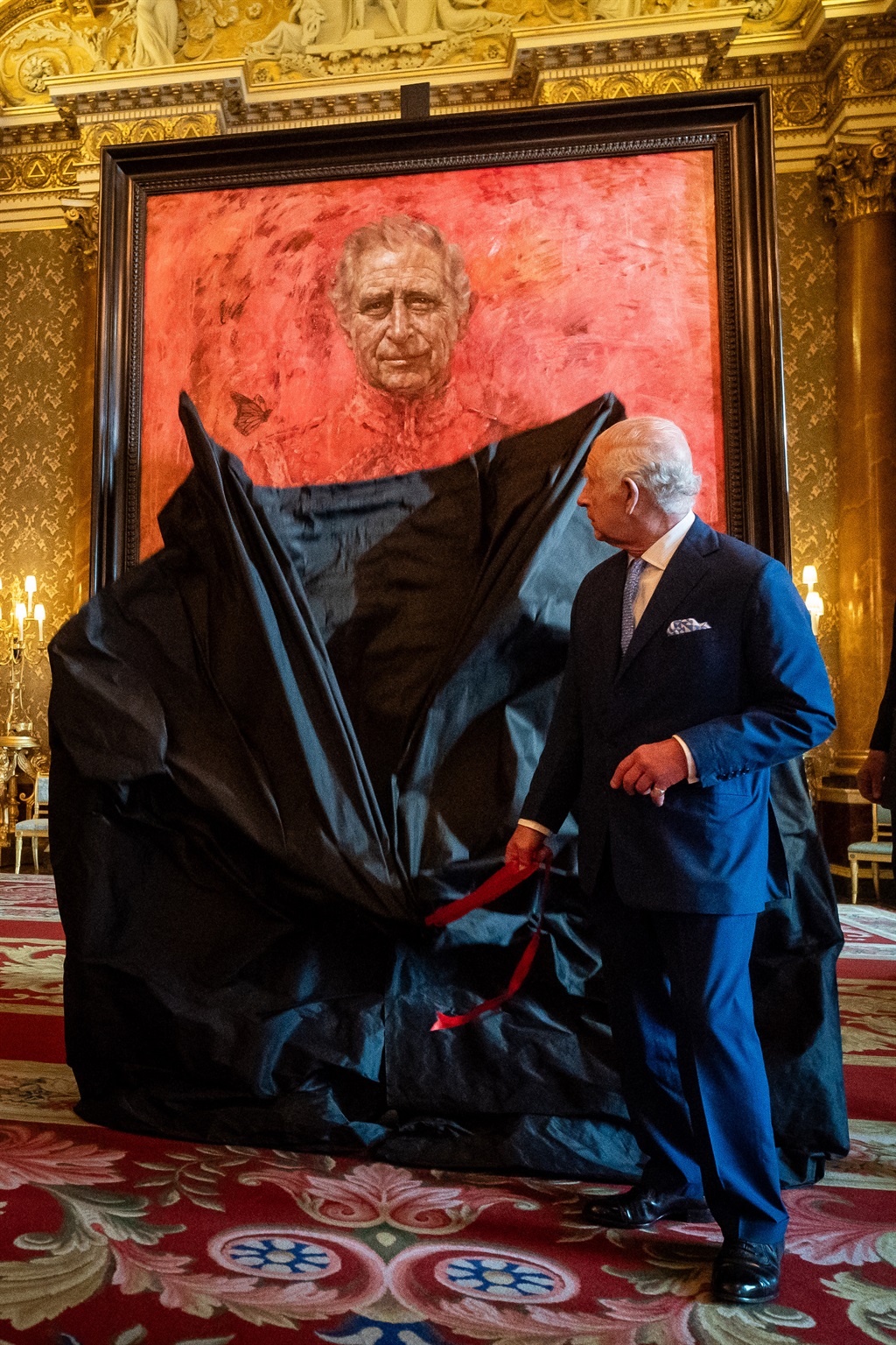 Britain's King Charles III unveils an official por
