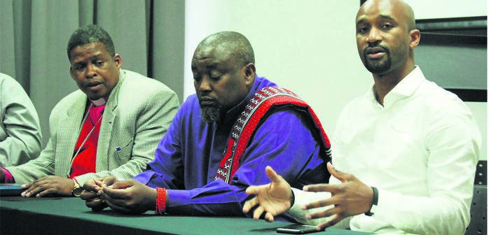 From left: Bishop Sandile Ndlela, Bishop Thulani Msomi and Andile Hlatshwayo claim people died after inhaling gasses from a landfill site. Photo by Phumlani Thabethe