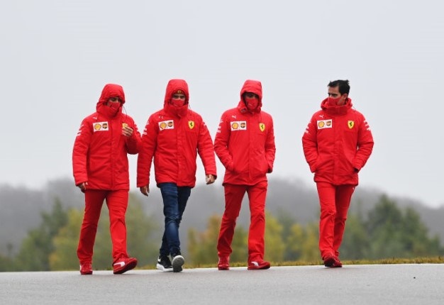 Charles Leclerc walks the track with his team during previews ahead of the F1 Eifel Grand Prix at Nuerburgring on October 8. Image: Clive Mason - /Formula 1 via Getty. 