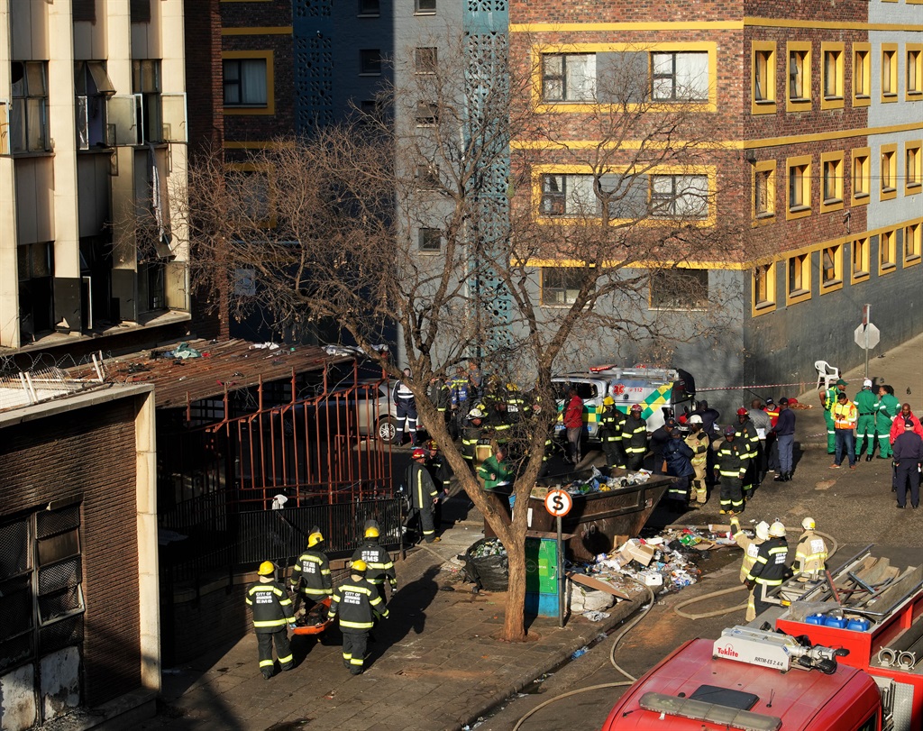 Johannesburg Emergency Management Services recovering burnt bodies from the Usindiso building. Photo by Tebogo Letsie
