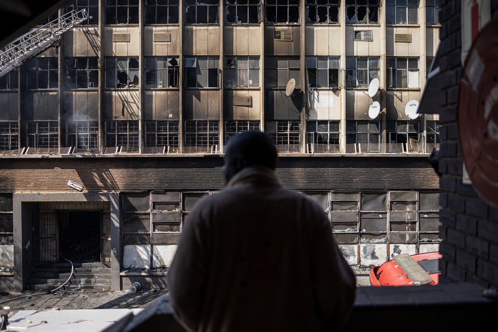 Toddler thrown from burning building in South Africa after looters