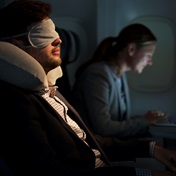 How can I get better sleep on long-haul flights?