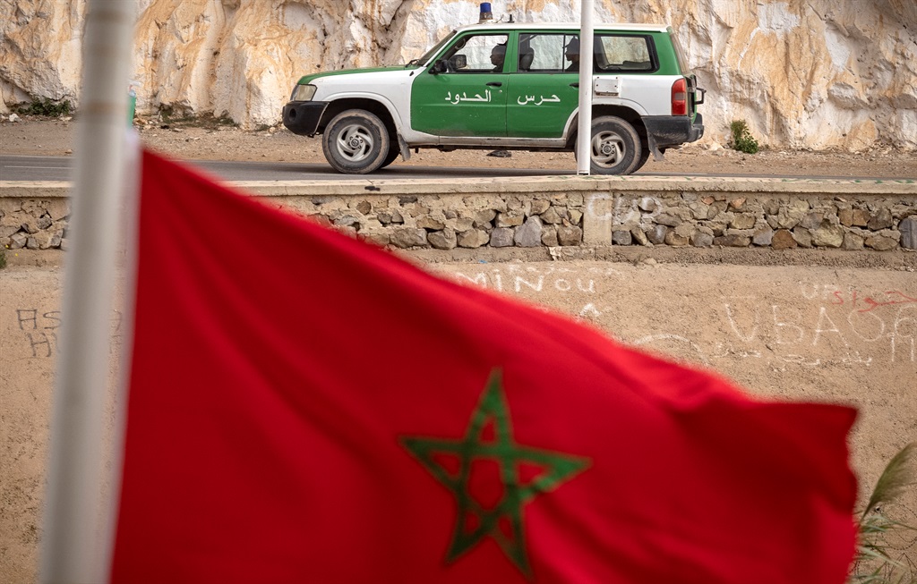 A picture taken from the Moroccan region of Oujda shows Algerian border guards patrolling along the border with Morocco on 4 November 2021.