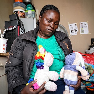 Precious Ngwenya (40) holds two of her children's favourite animals at her home in Mamelodi, Pretoria. (Chante Schatz, News24)