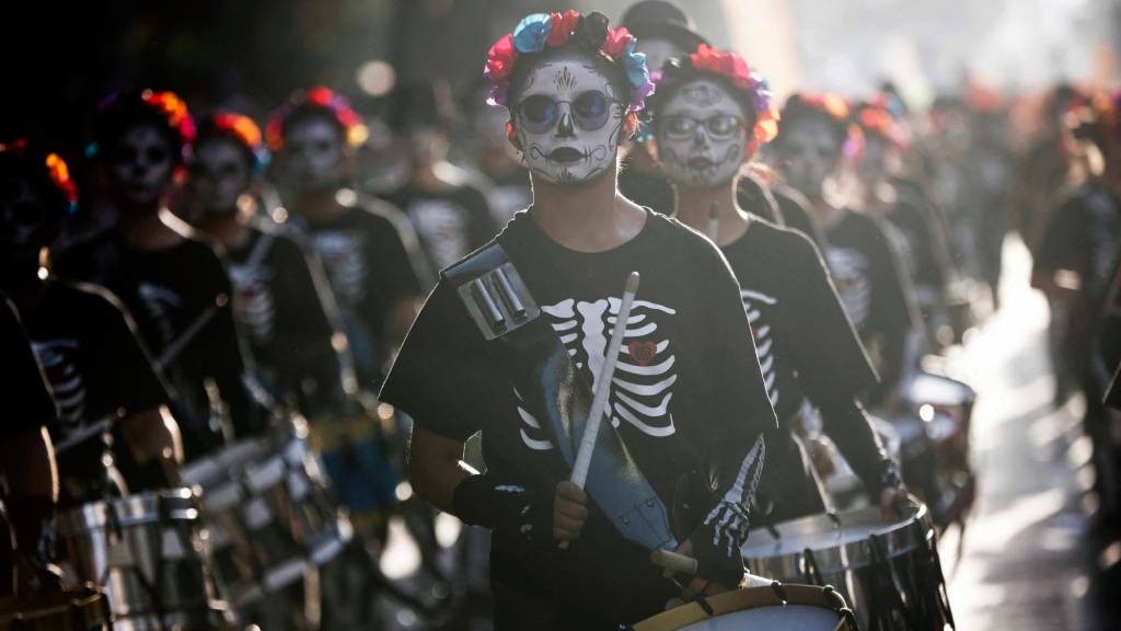 People take part in the Day of the Dead Parade in 