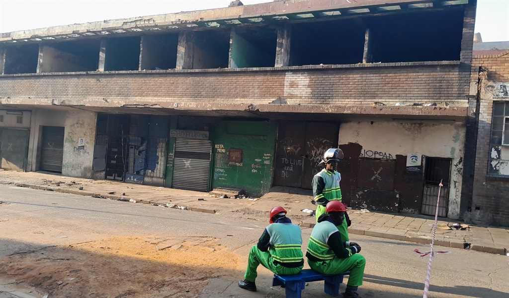 Security Officers guarding a rundown building wher