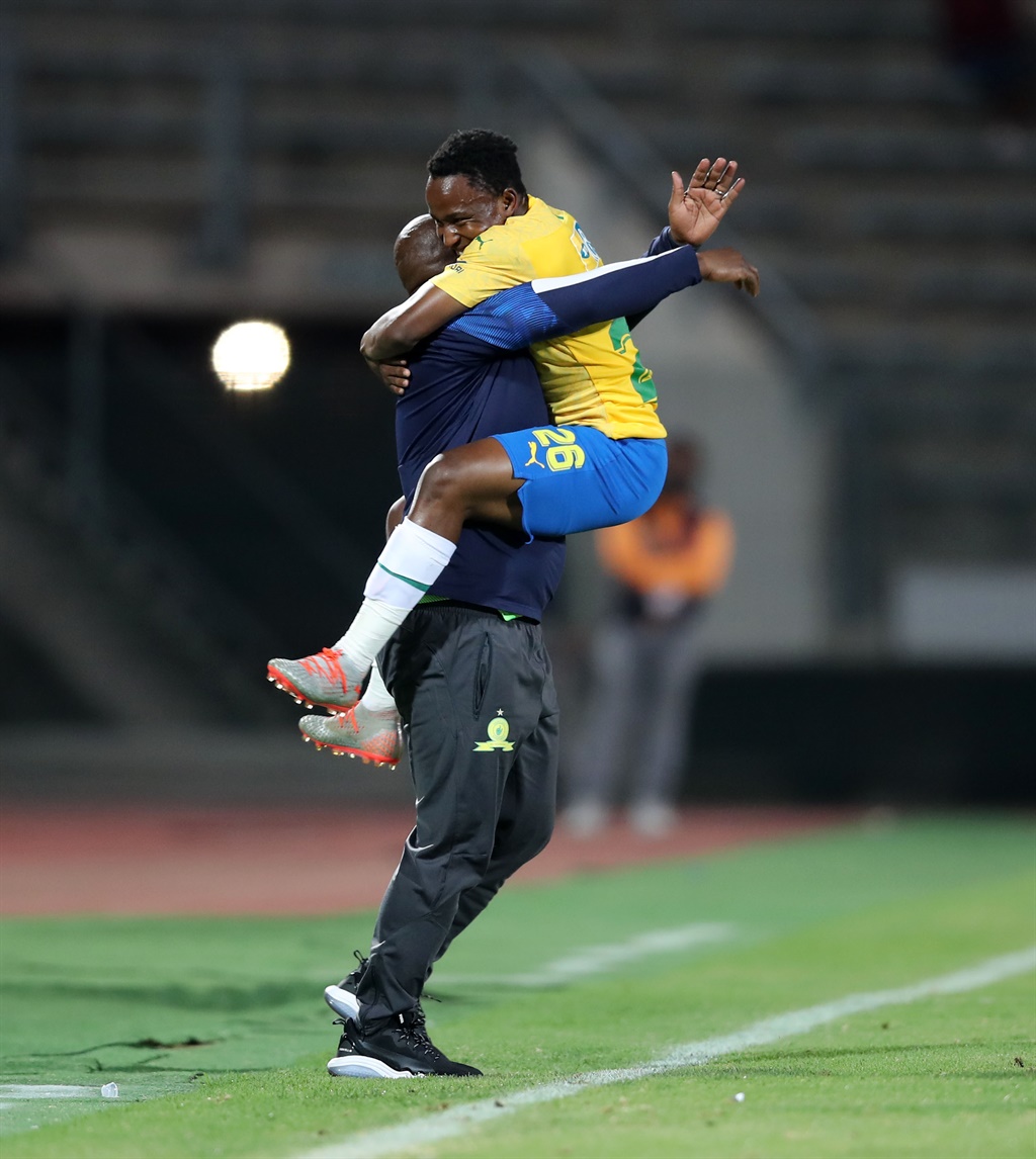 Mamelodi Sundowns coach Pitso Mosimane embracing his new star Keletso Makgalwa. Photo by BackPagePix