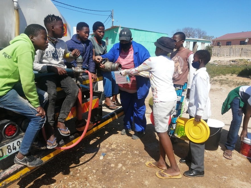 People in Govan Mbeki township, Port Elizabeth, collect water from a tanker. Day Zero has come to several areas in Nelson Mandela Bay. 