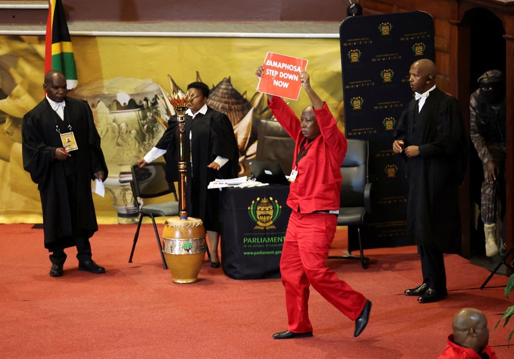 Economic Freedom Fighters party leader Julius Malema protests on stage as President Cyril Ramaphosa attempts to deliver his 2023 state-of-the-nation address (SONA) at the Cape Town City Hall on 9 February 2023.