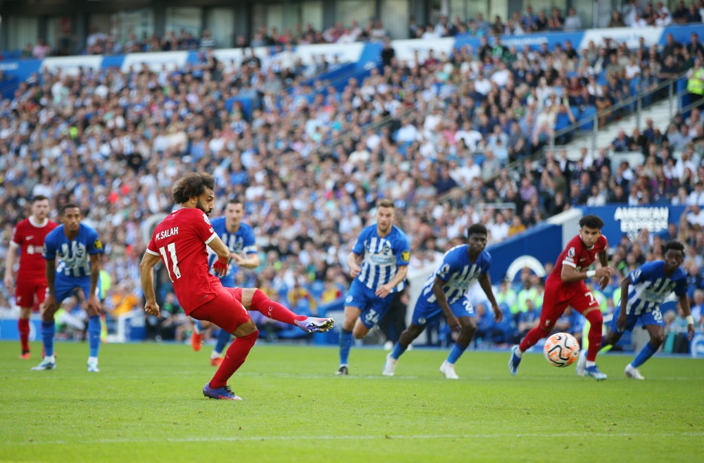 BRIGHTON, ENGLAND - OCTOBER 08: Mohamed Salah of Liverpool scores the teams second goal from a penalty during the Premier League match between Brighton & Hove Albion and Liverpool FC at American Express Community Stadium on October 08, 2023 in Brighton, England. (Photo by Steve Bardens/Getty Images)