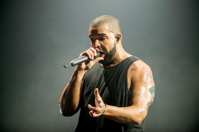 Bras galore! Drake flaunts the huge lingerie collection his fans have flung  at him on stage