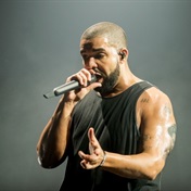 Bras galore! Drake flaunts the huge lingerie collection his fans have flung at him on stage