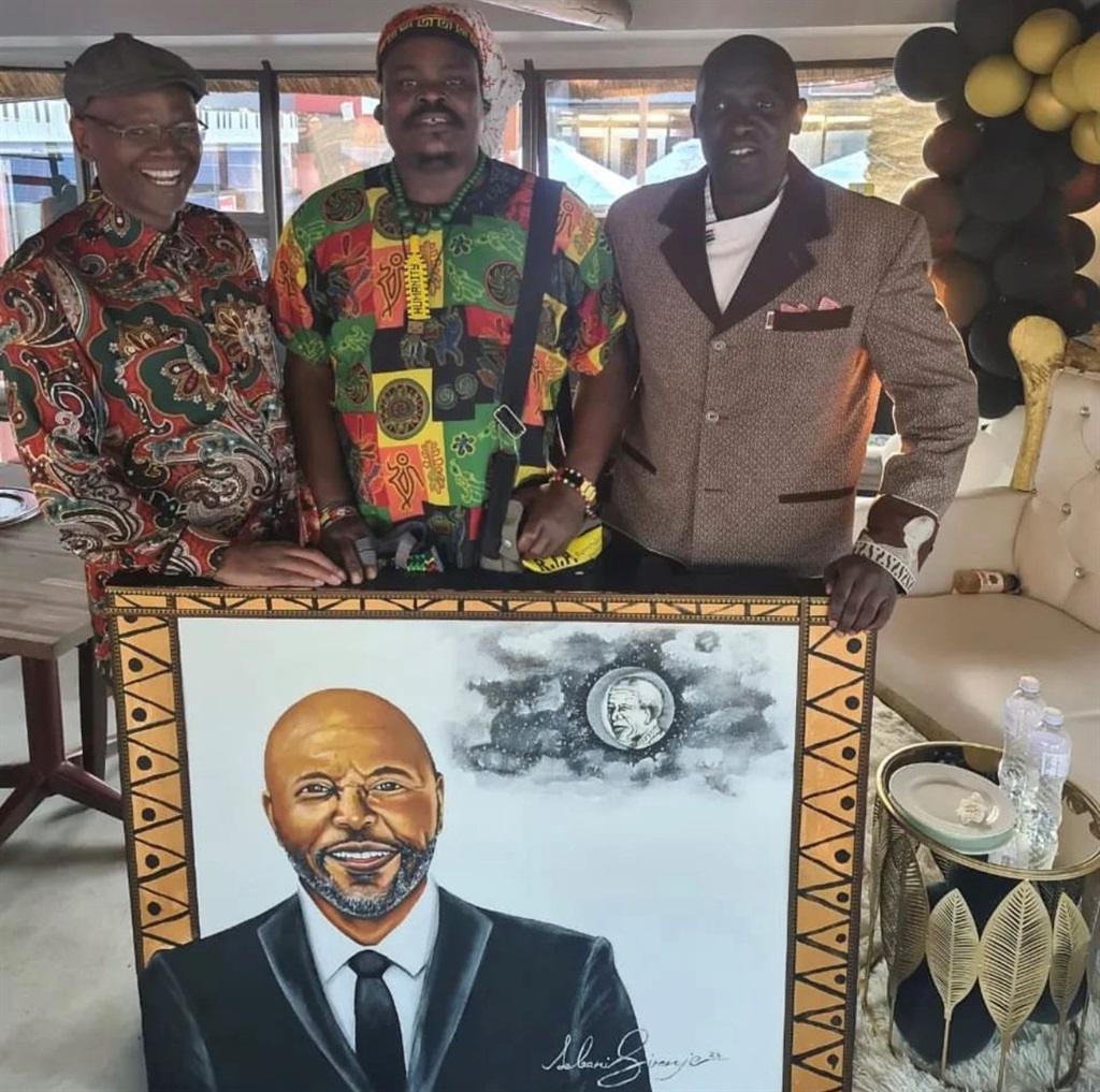 Rasta with his painting of Lucas Radebe.