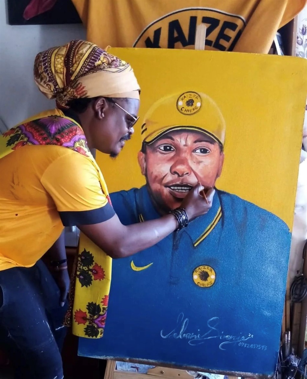 Rasta with his painting of Doctor Khumalo. 