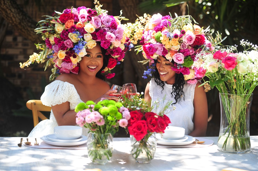 Celebrity Chef Lazy Makoti Mogau Seshoene and gardener Mosa Seshoene celebrate Garden Day with a picnic and flower crown. 