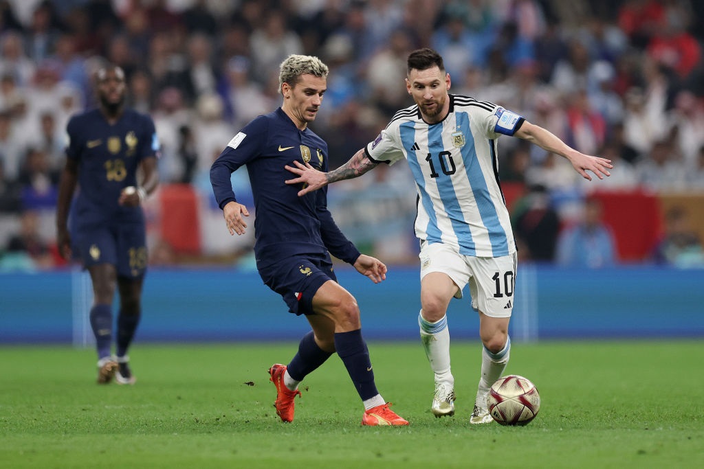 LUSAIL CITY, QATAR - DECEMBER 18: Lionel Messi of Argentina controls the ball against Antoine Griezmann of France during the FIFA World Cup Qatar 2022 Final match between Argentina and France at Lusail Stadium on December 18, 2022 in Lusail City, Qatar. (Photo by Clive Brunskill/Getty Images)