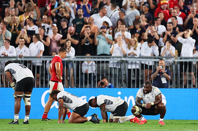 Fijian players left devastated at the final whistle.