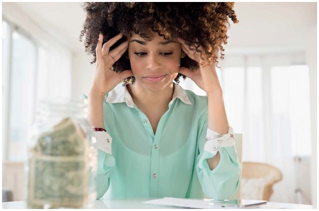 Woman stressed about money.