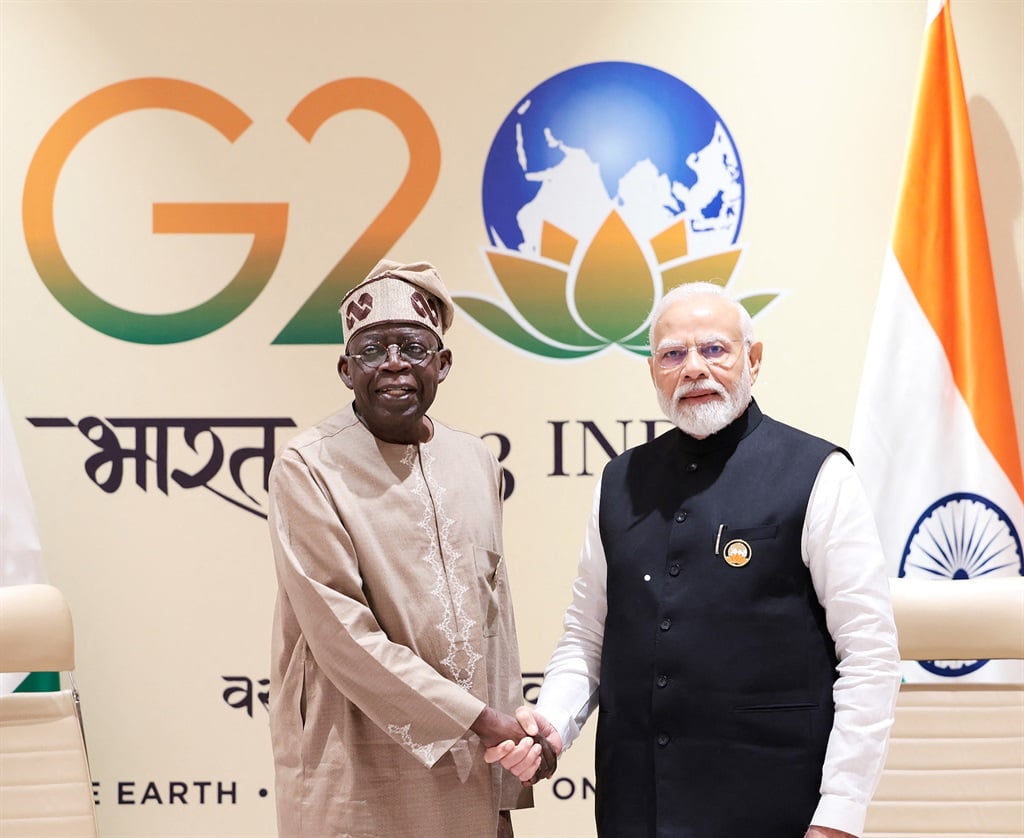 Indian Prime Minister Narendra Modi (R) and President of Nigeria Bola Ahmed Tinubu shake hands during a bilateral meeting after the closing session of the G20 summit in New Delhi on 10 September 2023.