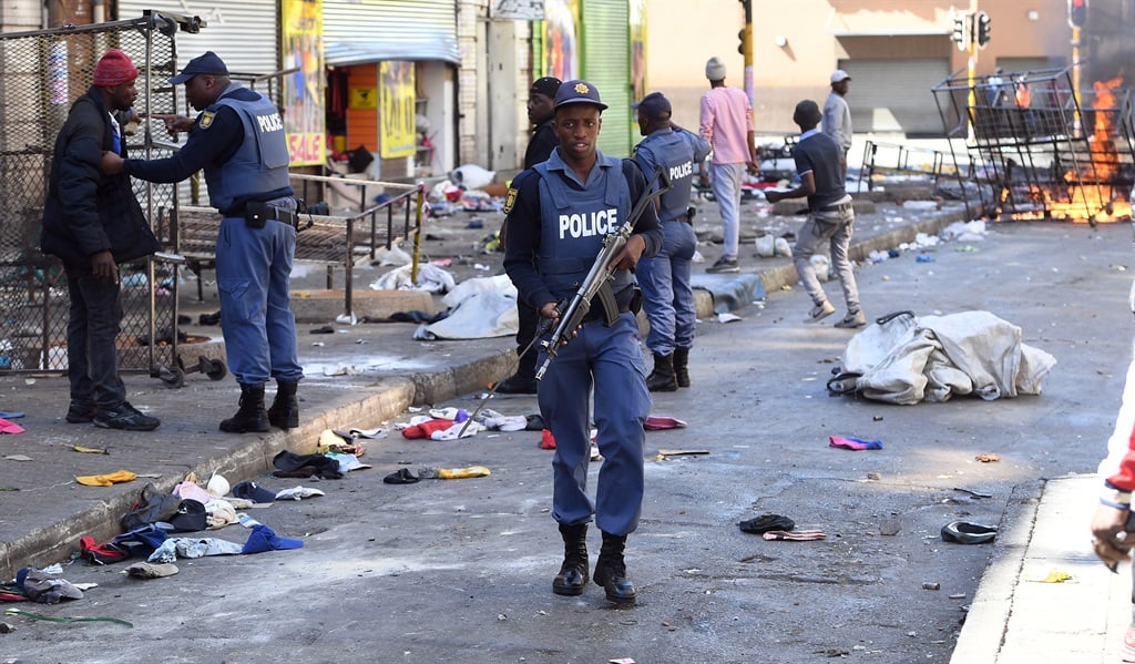 Police patrol Johannesburg after violence. (Felix Dlangamandla, file)