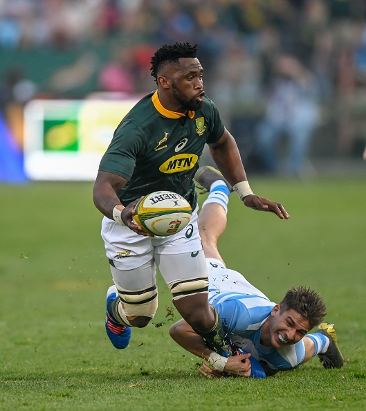 Argentina wing Sebastian Cancelliere (down) tackles South Africa flanker Siya Kolisi during their 2019 Rugby Union World Cup warm-up test match between South Africa against Argentina at the Loftus Versfeld Stadium in Pretoria, on August 17, 2019. (Photo by Christiaan Kotze / AFP)        (Photo credit should read CHRISTIAAN KOTZE/AFP/Getty Images)